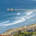 Square frame Wide shot of an island with a lot of properties and a long bridge towards the ocean. Royalty Free Stock Photo