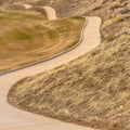 Square frame Winding narrow rural road through foothills