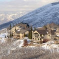 Square frame Winter in Utah with snowy Wasatch Mountains and lovely mountain homes views