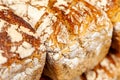 Square fresh tasty brown bread loafs uncut outer crust with flour extreme closeup, advertisement food macro. Bread closeup macro Royalty Free Stock Photo