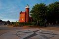 Square in front of baltic sea lighthouse in ustka town on the sunset. ustka, poland Royalty Free Stock Photo