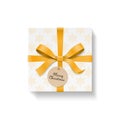 Square gift box, gold color bow knot and ribbon with circle kraft hang tag. Snowflake pattern paper.