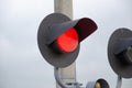 Square Grade crossing signal with red light gate and crossbuck at railroad crossing. Royalty Free Stock Photo