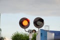 Square Grade crossing signal with red light gate and crossbuck at railroad crossing Royalty Free Stock Photo