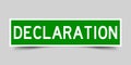 Square green sticker with word declaration on gray background