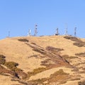 Square Group of communications towers on a hilltop Royalty Free Stock Photo
