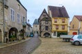 Square with half-timbered houses, in the medieval village Noyers-sur-Serein Royalty Free Stock Photo