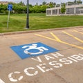 Square Handicapped parking lot with painted handicap symbol and Van Accessible sign Royalty Free Stock Photo