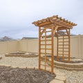 Square Heart shaped planting beds and wooden arbor at the yard of a home Royalty Free Stock Photo