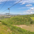 Square Hiking trails and vibrant foliage under chairlifts and blue sky at off season
