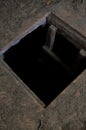 Hole in floor of old house leading to cellar Royalty Free Stock Photo