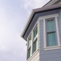 Square Home exterior in Park City Utah with bay window and gray horizontal wall siding Royalty Free Stock Photo