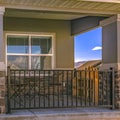 Square Home with stone brick wall and halloween decoration at the entrance