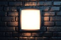 Square Illuminated Frame Mounted on Dark Brick Wall Royalty Free Stock Photo