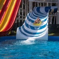 Square image of happy family at the water slide Royalty Free Stock Photo