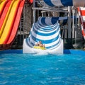 Happy family enjoys weekend at water park Royalty Free Stock Photo