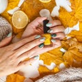 square image of manicure on green and grey nails with black and gold rhinestones with brilliant ornament on hand. golden Royalty Free Stock Photo