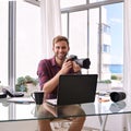 Square image of photographer holding his camera Royalty Free Stock Photo