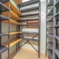 Square Interior of a small empty closet with metal and wood shelves for clothes