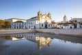 Square of Lagos city with cathedral in water reflection in Algarve Royalty Free Stock Photo