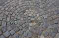 Square with a large dark gray circle inside a small round of cobblestone cubes. the stone is granite and basalt. a court of honor Royalty Free Stock Photo