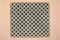 A square lattice window in the pink wall Royalty Free Stock Photo