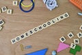 Alphabet letters with text HOMESCHOOLING over wooden background Royalty Free Stock Photo