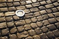 Square lined with cobblestone or stone pavement, walkway or road. The surface of rough stones and rough. The cobbles Royalty Free Stock Photo
