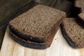 Square loaf of black rye bread Cut into pieces