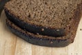 Square loaf of black rye bread Cut into pieces Royalty Free Stock Photo