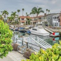 Square Long Beach coastal neighborhood landscape with boats and docks on the canal