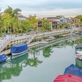 Square Long Beach neighborhood view featuring canal with stairs going down boat docks