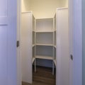 Square Looking into empty interior of a walk-in closet Royalty Free Stock Photo