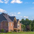 Square Luxury houses and golf course with mountain and blue sky in the background Royalty Free Stock Photo