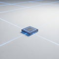A square, metallic object with illuminated edges, placed at the intersectio Royalty Free Stock Photo