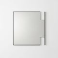A square mirror with a black frame on a white wall Royalty Free Stock Photo