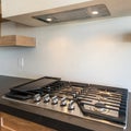 Square Modern craftsman kitchen counter with gas cooktop with griddle and custom vent hood insert