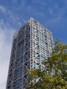 Square modern isolated office building on a blue skye background