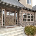 Square Modern urban home with feature stone brick wall Royalty Free Stock Photo