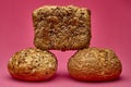 Square multigrain bread on two buns over pink background Royalty Free Stock Photo