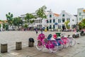 Square with multiple bikes parked on it and a group of people walking around in Jakarta, Indonesia. Royalty Free Stock Photo