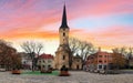 Square in Nove Zamky city with church, Slovakia at sunset