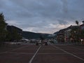 Square in the old center of TromsÃÂ¸ with the arctic hunter monument in the evening on a cloudy day.