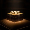 Ornate Golden Gift Box with Glittering Ribbon on a Padded Surface present Royalty Free Stock Photo