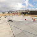 Square Park and childrens playground against homes and snow capped mountain in winter