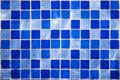 Square pattern of blue and light blue tiles for bath walls and floor design or swimming pool design. Water blinks on tiled walls i Royalty Free Stock Photo