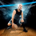 Square photo of basketball player in action dribbles in the gam Royalty Free Stock Photo