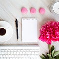 a blank notebook, pink peony flower, coffee cup, pen, sweet macarons and keyboard, Royalty Free Stock Photo