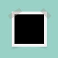 Square photo frames with sticky tape on green background. Royalty Free Stock Photo