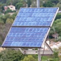 Square Photovoltaic solar panel for renewable energy on a cloudy day Royalty Free Stock Photo